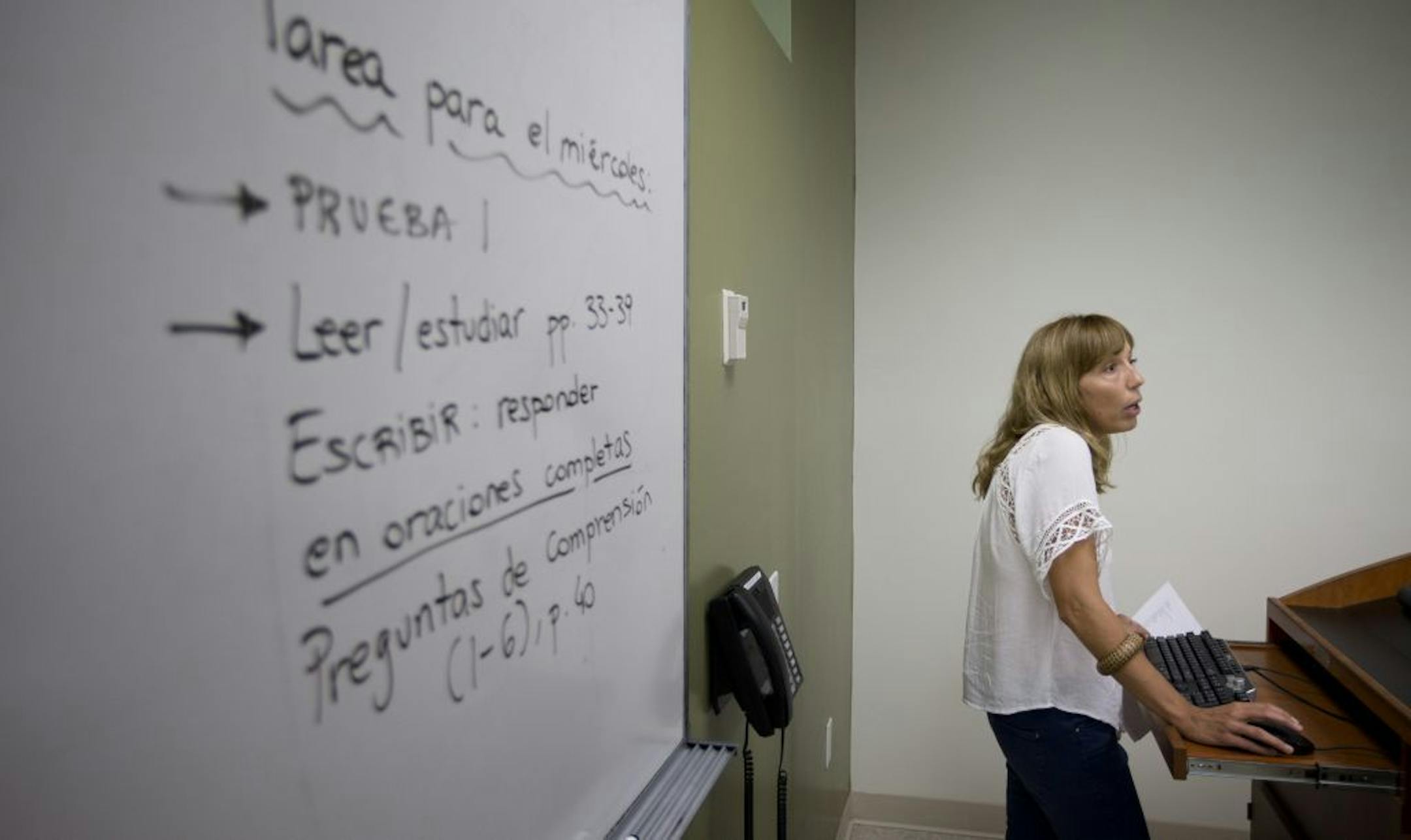 In this Sept. 9, 2013 photo, University of Miami professor Francisca Aquilo-Mora works with students in her Spanish language class in Coral Gables, Fla.