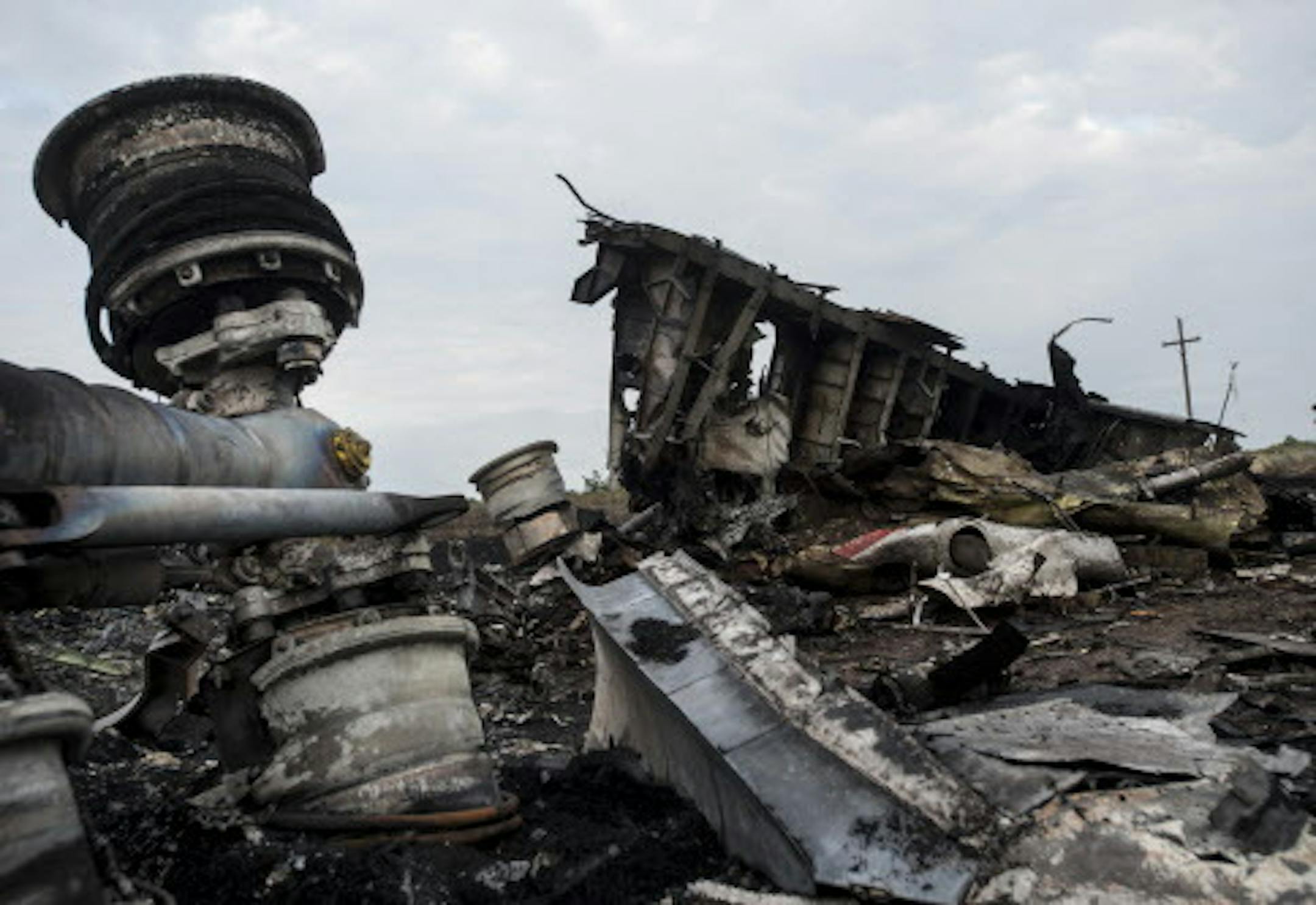 The wreckage of Malaysia Airlines Flight 17 near the village of Hrabove, eastern Ukraine, early Saturday, July 19, 2014. World leaders demanded Friday that pro-Russia rebels who control the eastern Ukraine crash site of Malaysia Airlines Flight 17 give immediate, unfettered access to independent investigators to determine who shot down the plane. (AP Photo/Evgeniy Maloletka)