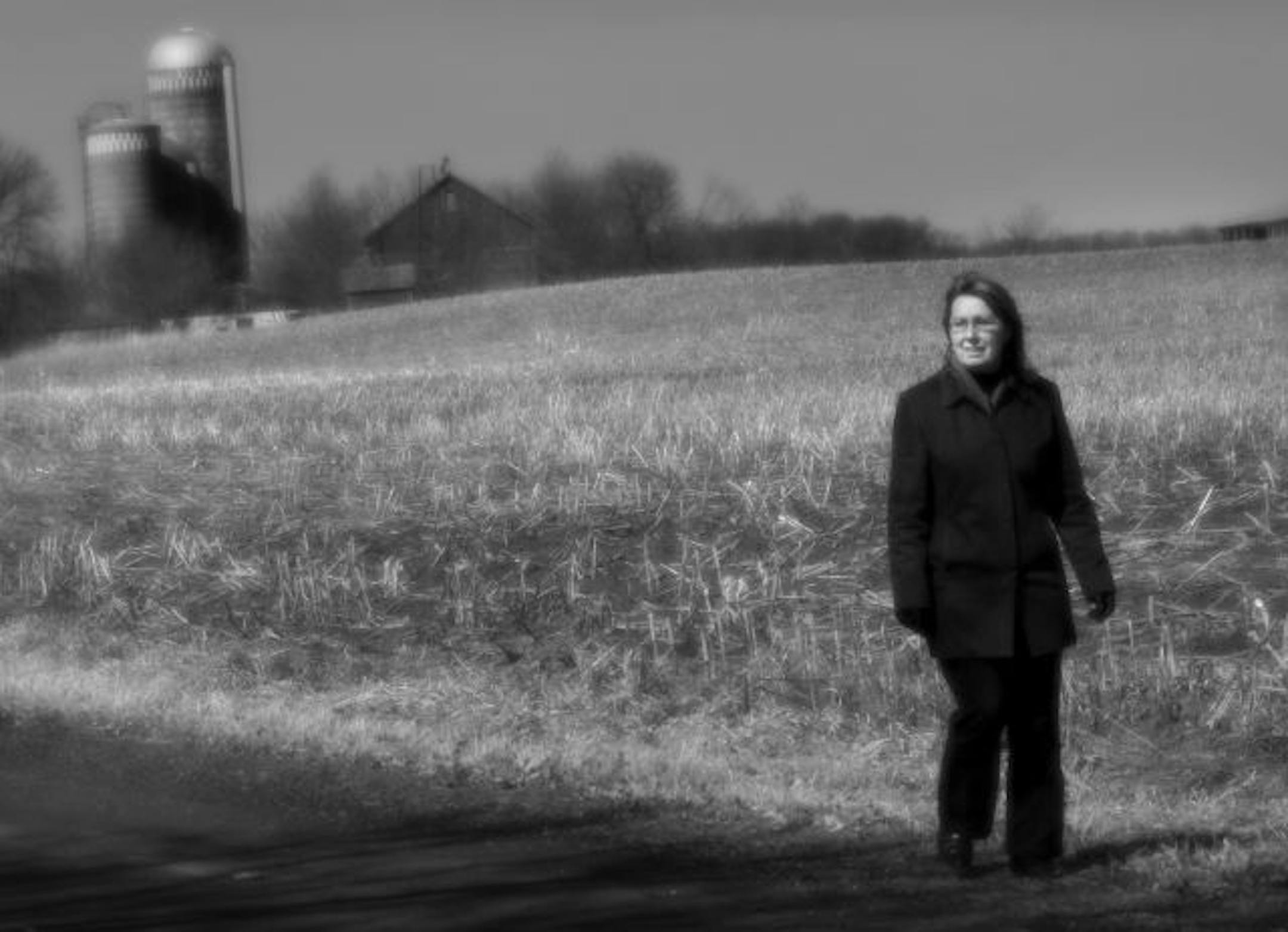 Gayla Marty walked the grounds near her family's farm north of Rush City, Minn. She has written a new memoir, "Memory of Trees," about growing up on the farm.