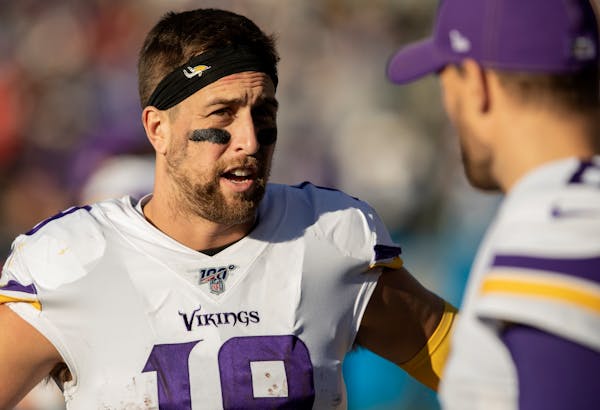 Adam Thielen, back, is the Vikings' senior receiver at age 29 and preeminent pass catcher