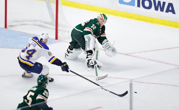 Alex Stalock, seen here playing the puck in a preseason game, picked up an assist in the Wild's 5-4 overtime victory Saturday against the Lightning. I