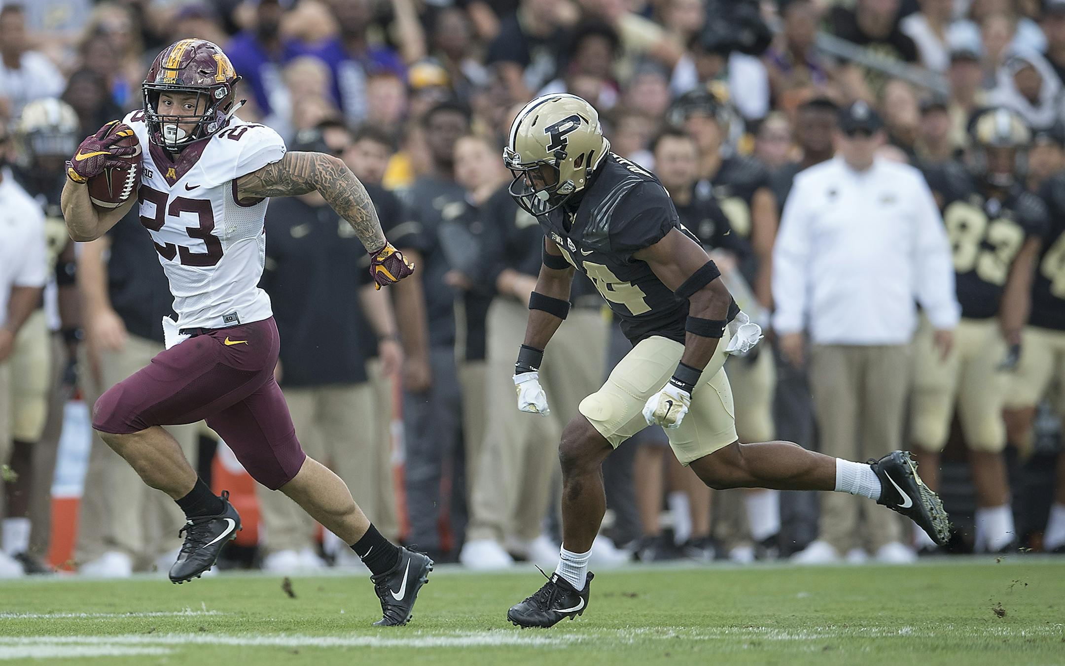 Minnesota's running back Shannon Brooks ran with the ball just short of the end zone chased by Purdue's cornerback Antonio Blackmon during the first quarter the Gophers took on Purdue at Ross-Ade Stadium, Saturday, October 7, 2017 in West Lafayette, IN.