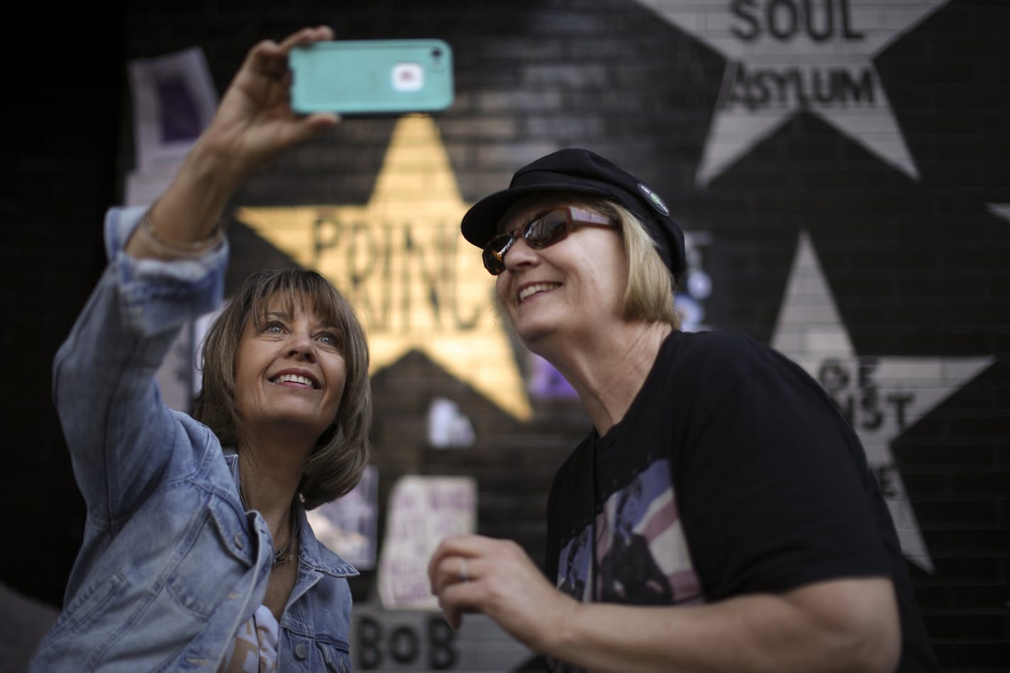 Jane Nett of Minneapolis took a selfie with her friend, Louis Kantack in front of Prince's star on the wall of First Ave. before they headed to see Paul McCartney.