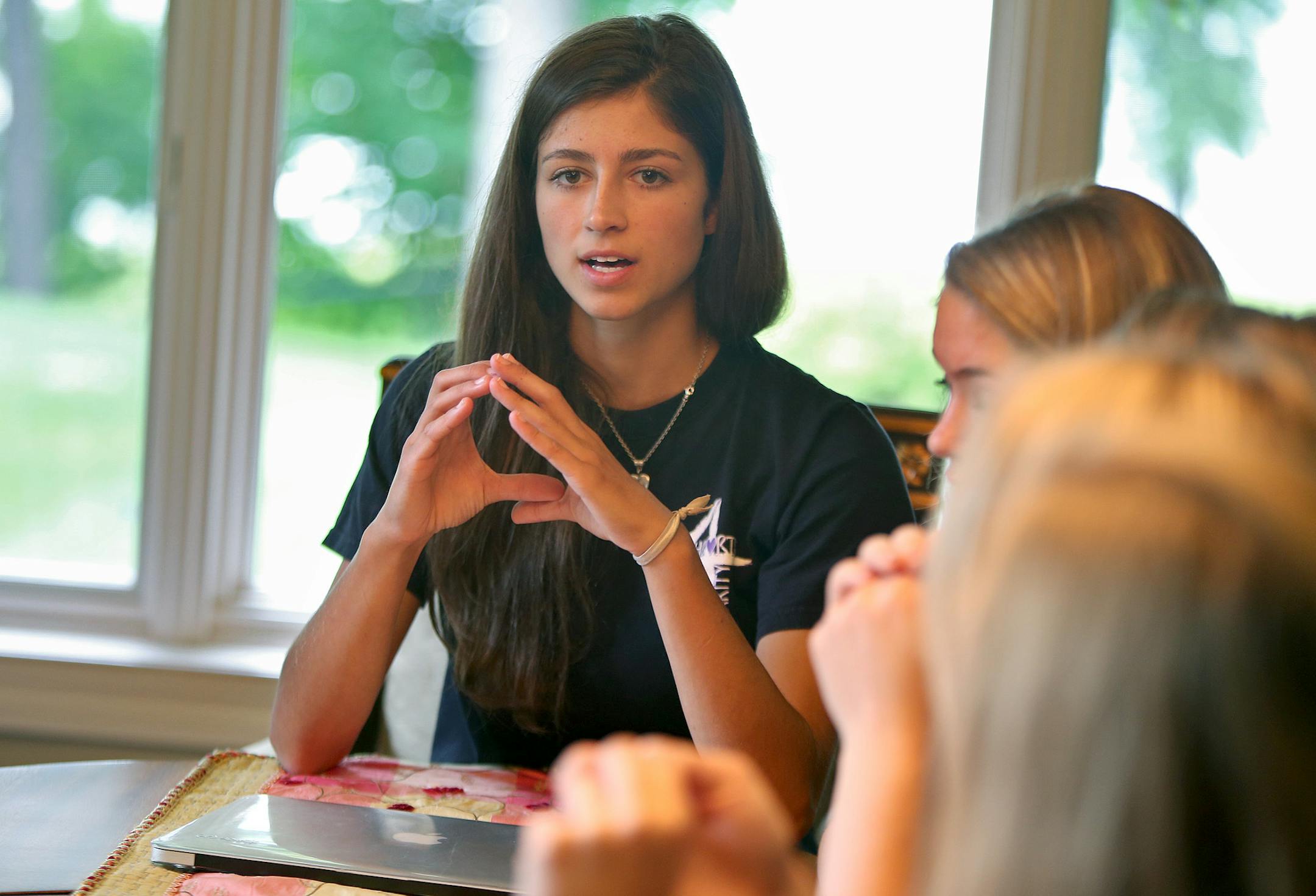 A group of Mahtomedi teens has recruited country singer Katie Armiger to raise money for Hearts4Charity, a mission to raise money for the International Justice Mission. The group gathered for a meeting led by president Amanda Sexson, Tuesday, July 30, 2013 in Mahtomedi, MN. (ELIZABETH FLORES/STAR TRIBUNE) ELIZABETH FLORES • eflores@startribune.com