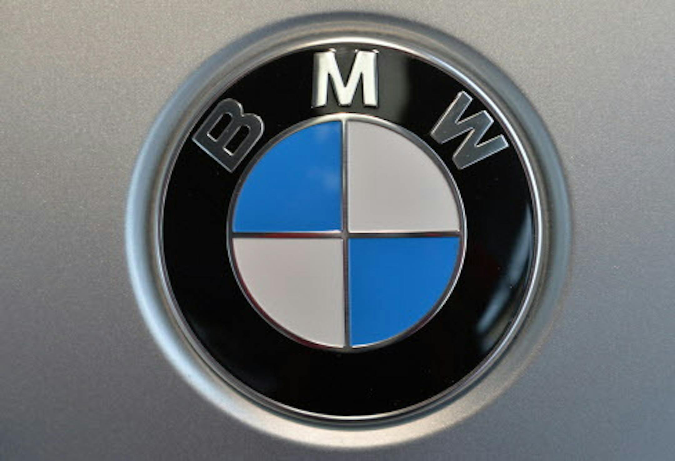 FILE - The March 19, 2014 file photo shows the company logo of car manufacturer BMW during the annual balance press conference in Munich, Germany. Booming sales in China and signs of life from the depressed European car market helped BMWís net profit rise 11 percent in the first quarter. Earnings rose 1.462 billion euros (US$ 2.03 billion) from 1.312 billion euros in the same quarter a year ago. The increase was higher than the 1.345 billion consensus compiled from analysts by financial inf