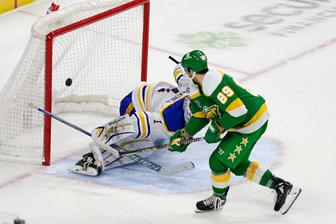 Wild center Frederick Gaudreau scores past Sabres goaltender Ukko-Pekka Luukkonen in Saturday's shootout