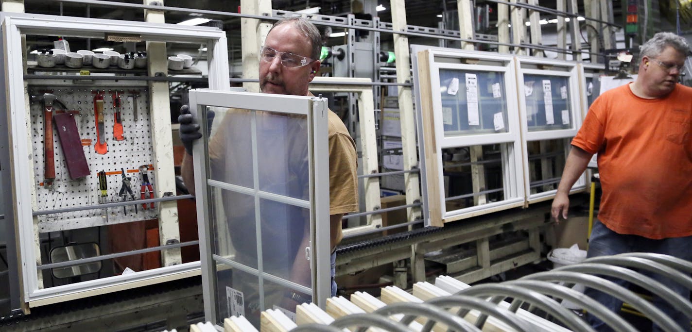 Andersen Windows uniline assembly employees Mike Rowley, left, and Kevin Krenz install sashes in doublehung frames Wednesday, April 30, 2014, in Bayport MN.](DAVID JOLES/STARTRIBUNE) djoles@startribune Andersen Windows is set to announce an $18 million expansion to its plant in Bayport. The move will create 100 jobs for the riverside town, with an average pay rate of $19 an hour. Andersen employs about 2,400 workers in Bayport and about 9,000 in North America. The Anderson manufacturing, distrib