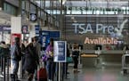 Travelers enter a TSA checkpoint Saturday. ] ANTHONY SOUFFLE &#x2022; anthony.souffle@startribune.com Officials have said security was heightened Satu