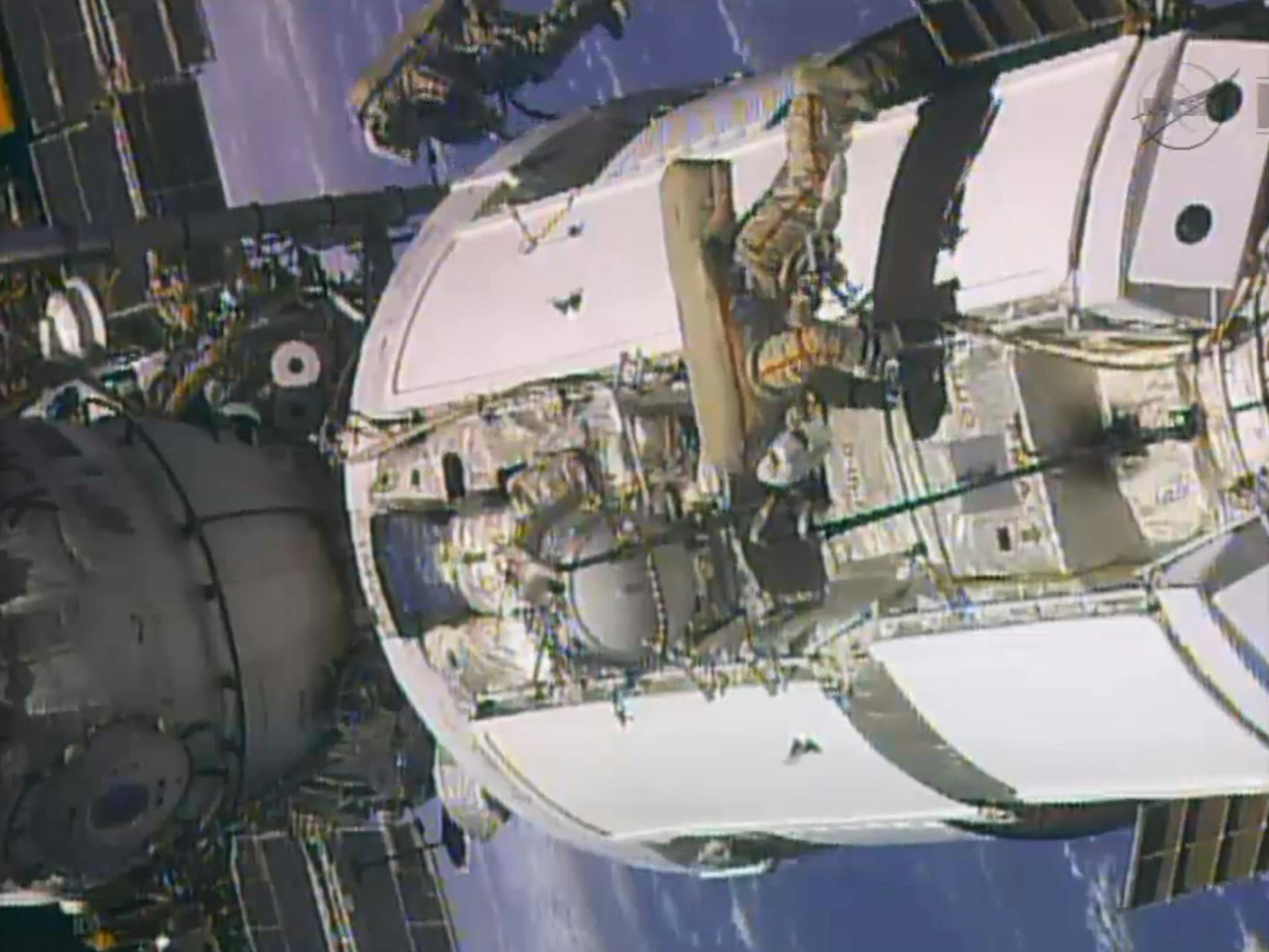 In this frame grab from video provided by NASA, two Russian flight engineers perform maintenance on the International Space Station, Monday, June 24, 2013. The crew includes three Russians, two Americans and one Italian. The Italian and one American will conduct a pair of spacewalks for NASA in July. (AP Photo/NASA)