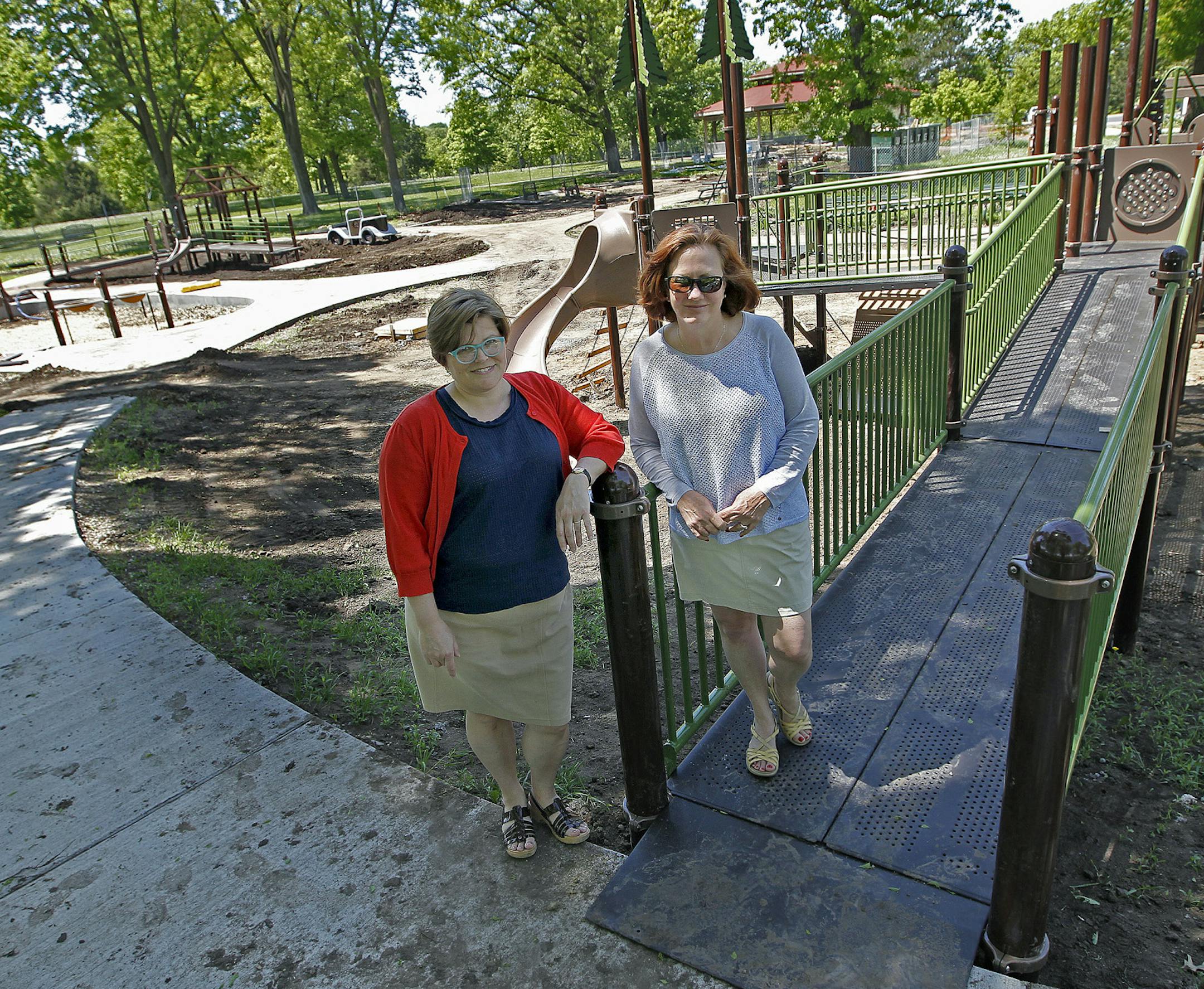 Andrea Weber, the project manager for the Minneapolis Park and Recreation Board, left, joined Peggy Halvorson of People for Parks at the universally accessible playground at the Wabun picnic area at Hiawatha Park on Thursday.