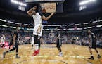 New Orleans Pelicans forward Anthony Davis (23) slam dunks in the first half of an NBA basketball game against the Minnesota Timberwolves in New Orlea