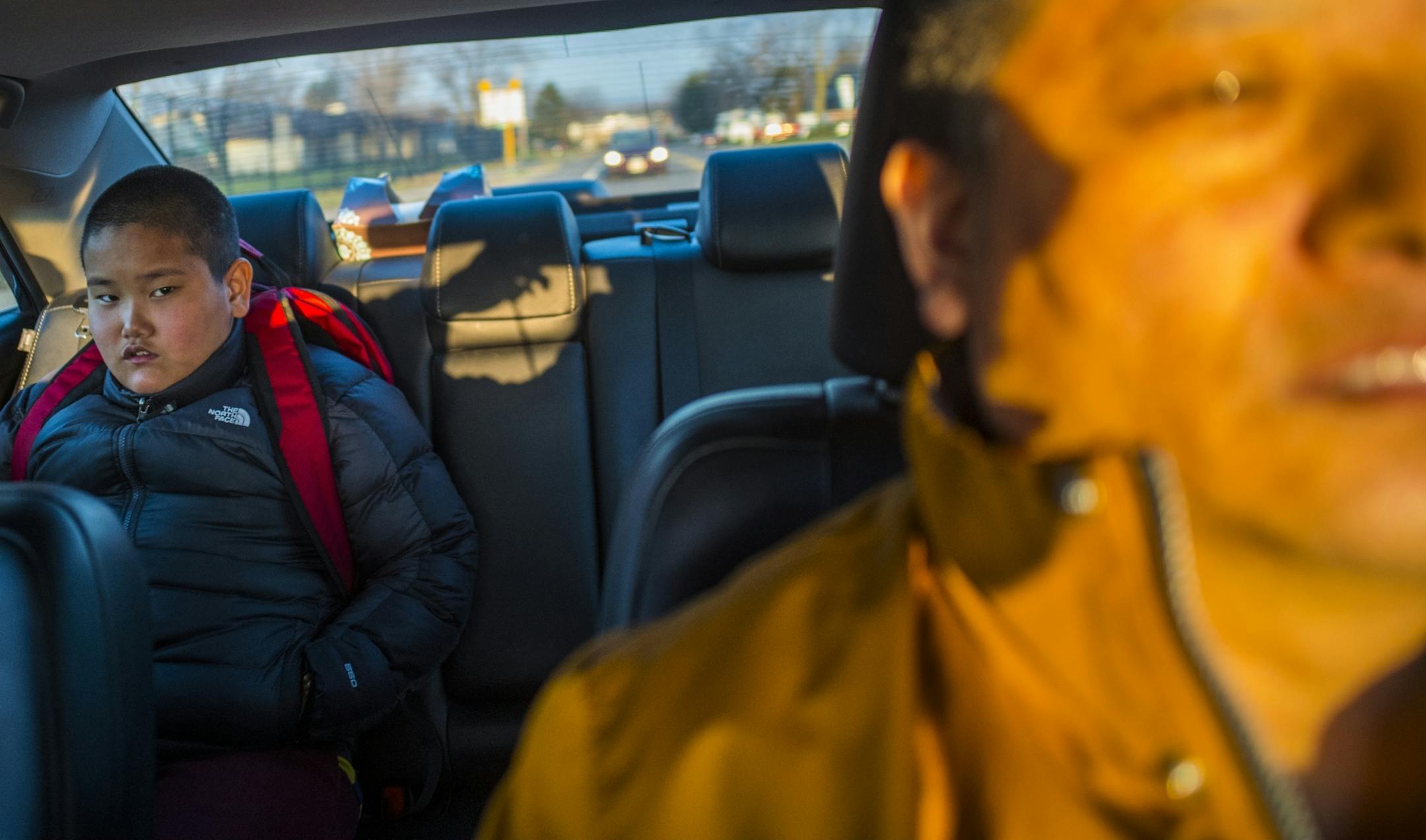 Jalue Dorjee,9, goes to school in Columbia Heights driven by his dad Dorje Tsegyal, who is also helps him with his Buddhist studies.