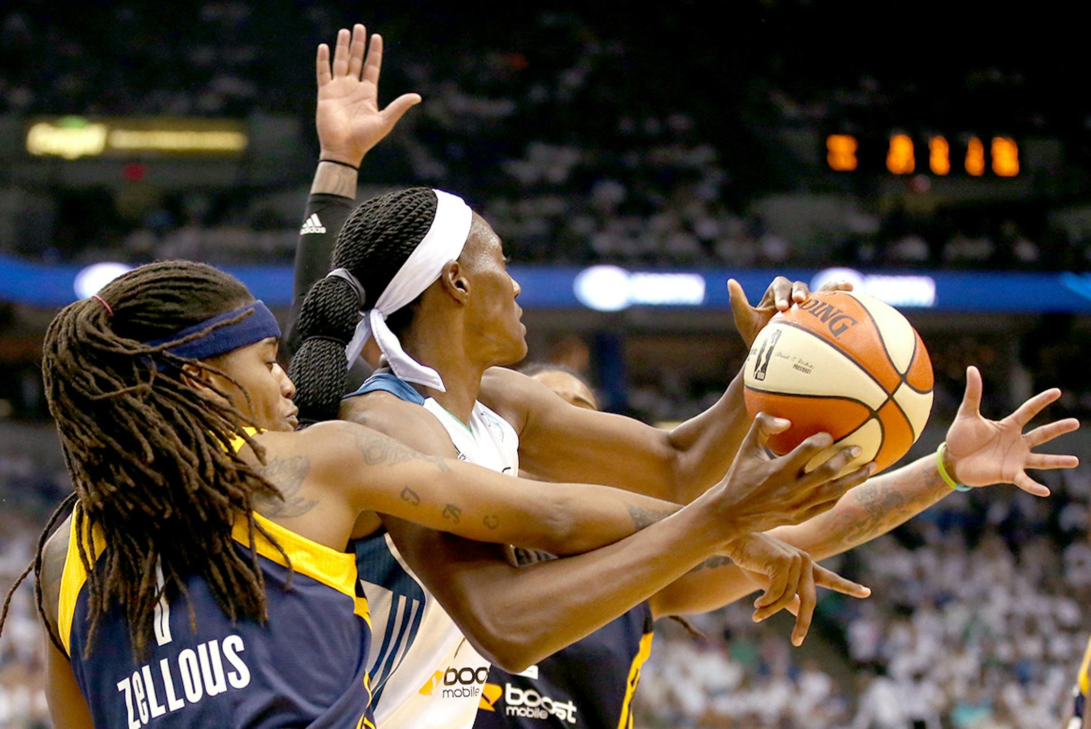Indiana Fever guard Shavonte Zellous (1) fouled Minnesota Lynx center Sylvia Fowles (34) as she tried to pass during the first half.