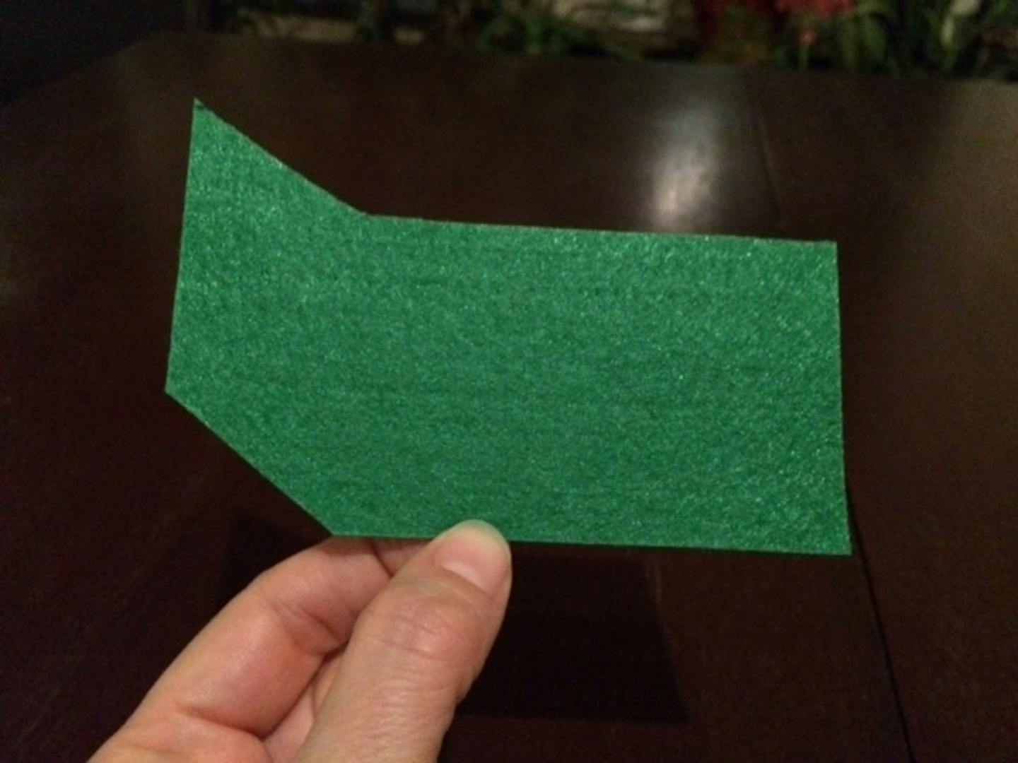 Part of step-by-step instructions for crafting a felt dumpster fire holiday ornament.