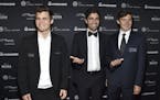 Current world chess champion Magnus Carlsen, from left, Adrian Grenier and chess grandmaster Sergey Karjakin attend the World Chess Championship Openi