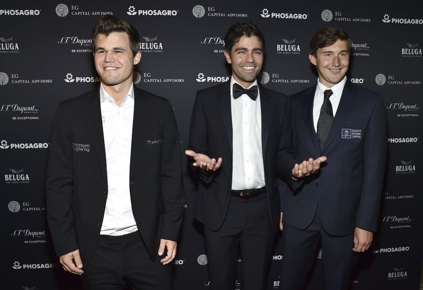 Current world chess champion Magnus Carlsen, from left, Adrian Grenier and chess grandmaster Sergey Karjakin attend the World Chess Championship Opening Night Gala at The Plaza Hotel on Thursday, Nov. 10, 2016, in New York.