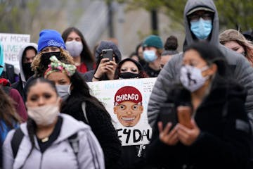 Students gathered outside U.S. Bank Stadium on Monday afternoon as part of a statewide student walkout to protest against racial injustice in Minneapo