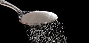 Granulated sugar is poured in Philadelphia, Monday, Sept. 12, 2016. A new study released Monday details how the sugar industry worked to downplay emer