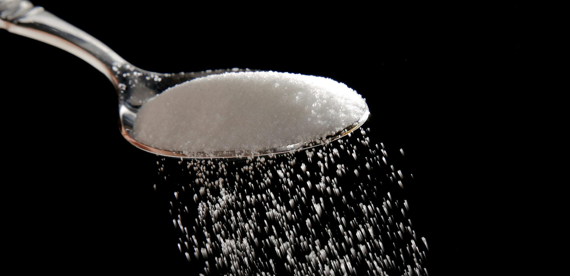 Granulated sugar is poured in Philadelphia, Monday, Sept. 12, 2016. A new study released Monday details how the sugar industry worked to downplay emerging science linking sugar and heart disease. It's the latest installment of an ongoing project by a former dentist to reveal the industry's decades-long attempt to influence science. The Sugar Association said it questions the author's attempt to play into current anti-sugar sentiment. (AP Photo/Matt Rourke) ORG XMIT: MIN2016091312485817