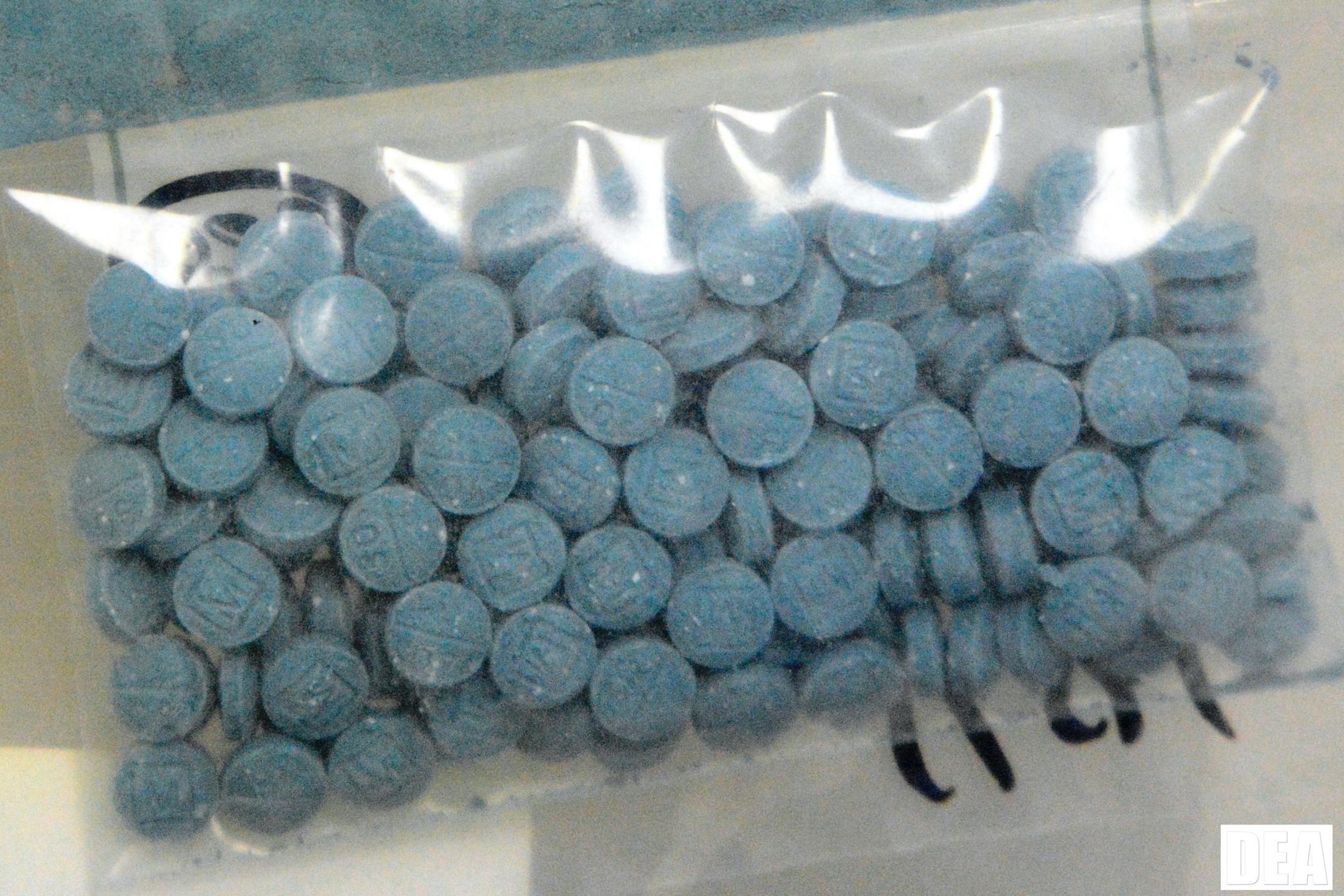 This undated photo made available by the U.S. Drug Enforcement Administration shows heroin fentanyl pills.