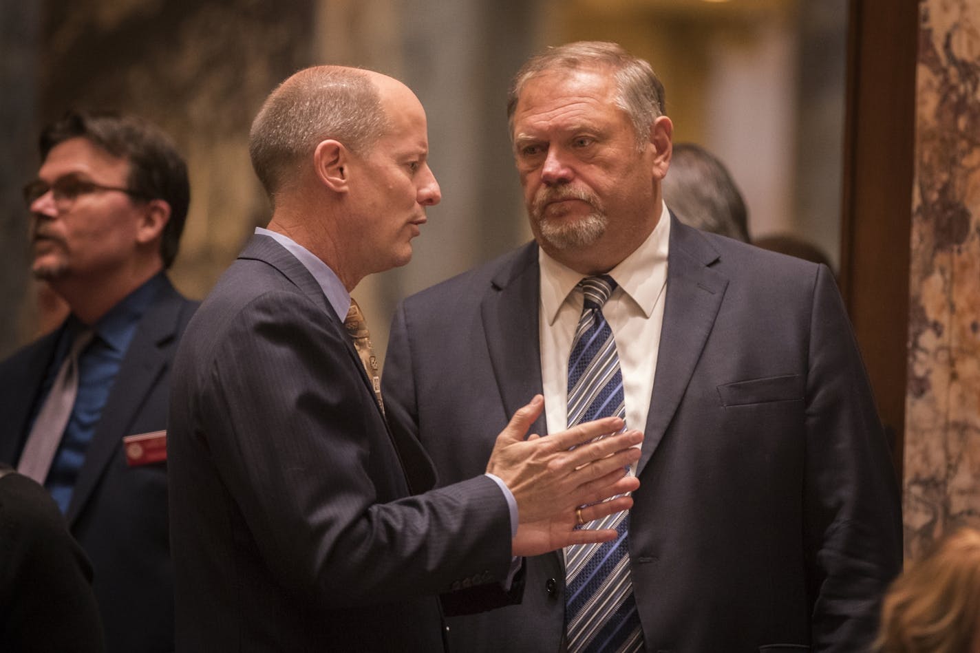 Senate Majority Leader Paul Gazelka, left, and Senate Minority Leader Tom Bakk talk before the session in the Minnesota Senate chambers.