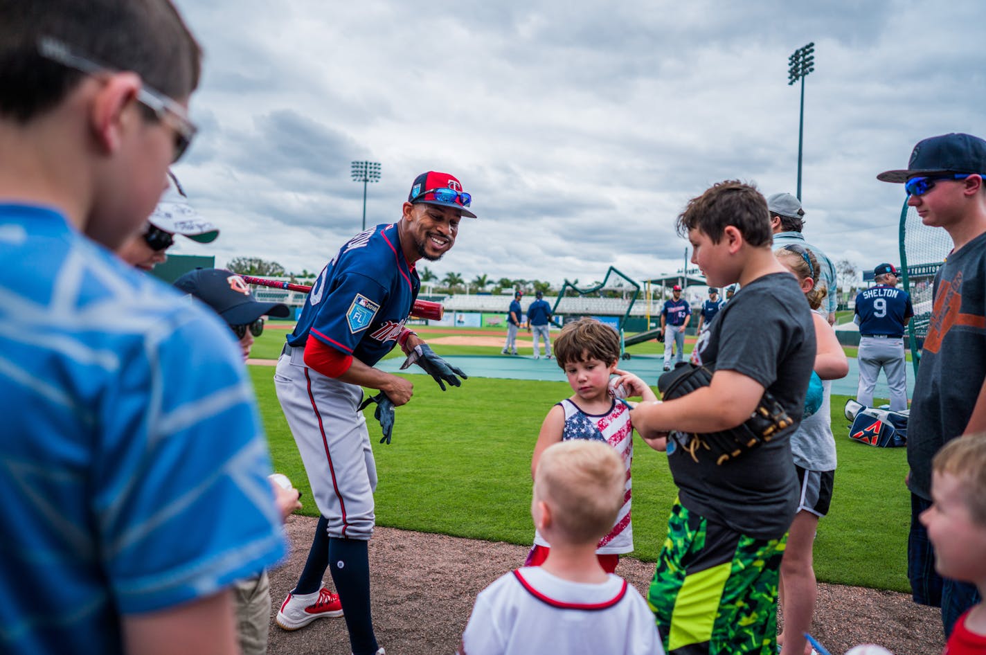 Twins outfielder Byron Buxton (25) signed balls for kids during batting practice. ] MARK VANCLEAVE &#xef; mark.vancleave@startribune.com * The first day of full-squad workouts at Twins spring training in Fort Myers, Florida on Monday, Feb. 19, 2018.