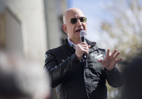 FILE &#xf3; Jeff Bezos, the founder of Amazon, discusses his Blue Origin reusable rocket project in Colorado Springs, Colo., April 5, 2017. A bump in 