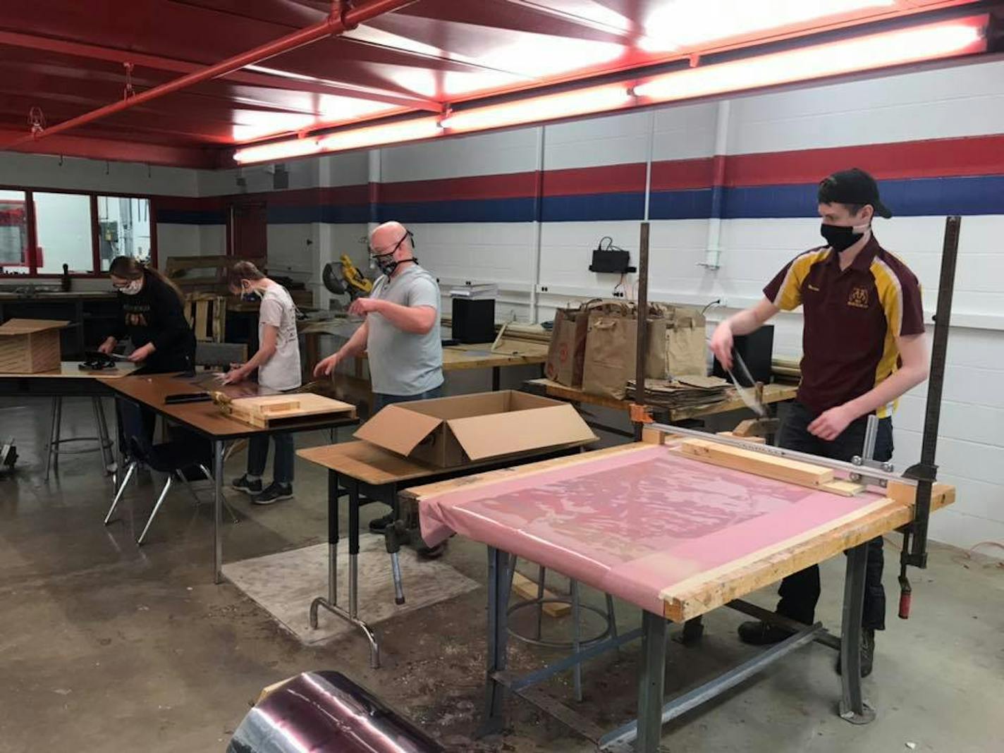 Team members of the KnightKrawler robotics team at Irondale High School in Mounds View at work making face shields. ORG XMIT: gtAonKwU7IWm9H1XJw0V