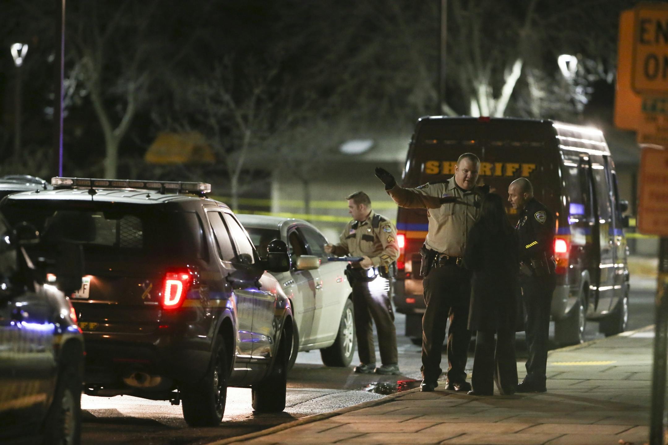 Hennepin County Sherrif's personnel outside the New Hope Police Department after two police officers were shot Monday, Jan. 26, 2015 in New Hope, Minn.