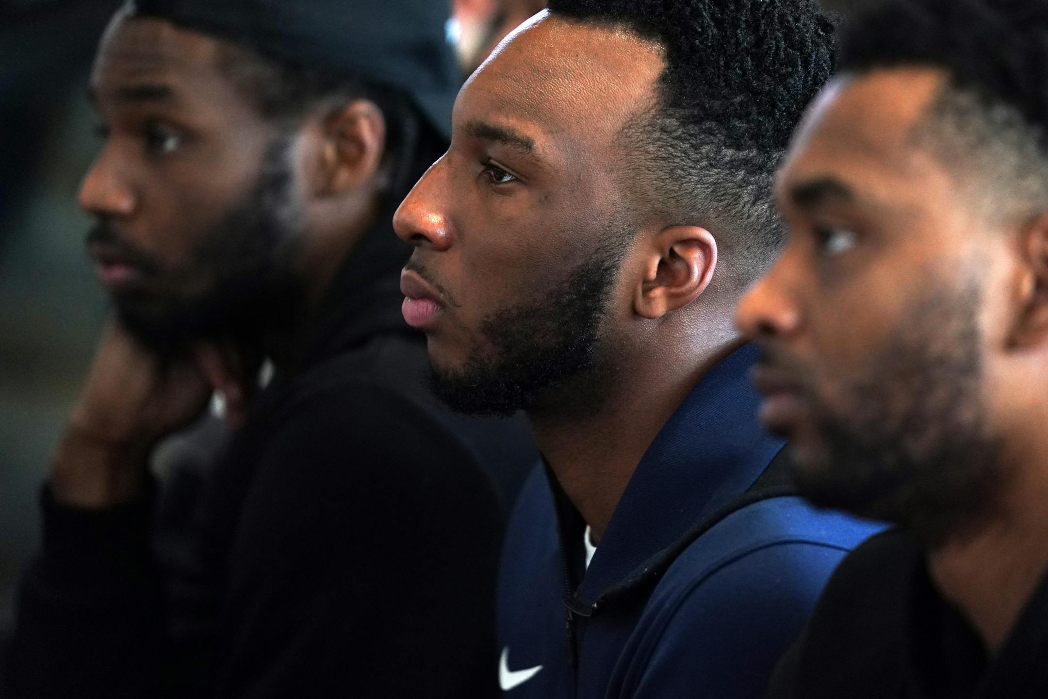 Minnesota Timberwolves guard Josh Okogie (20), center, sat with a group of players during Tuesday's press conference.