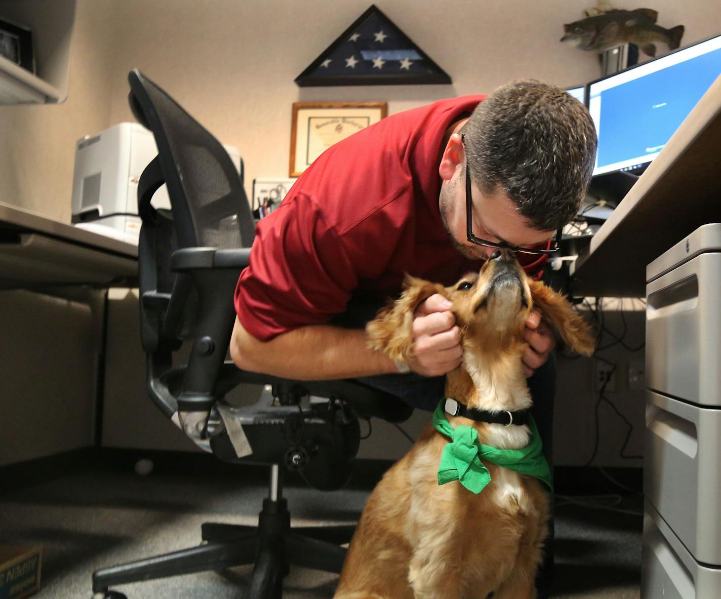 Tony Tengwall, a veterans service officer, with his service dog Fitz. "Training the public is the most important thing," he says.