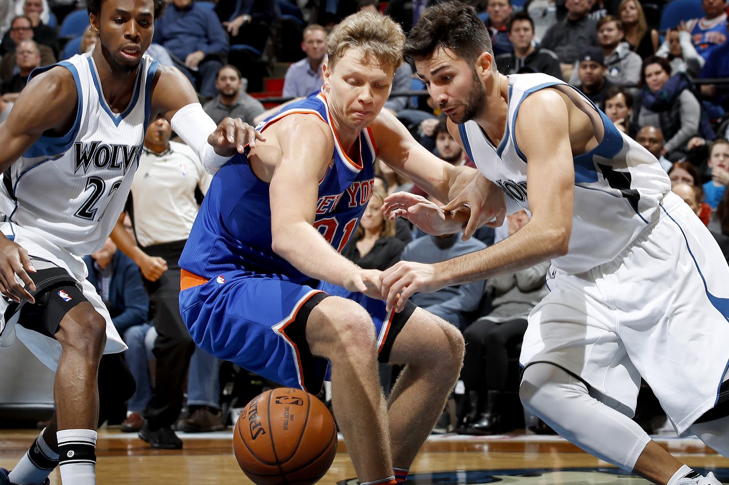 Andrew Wiggins (22) and Ricky Rubio (9) fought for a loose ball with Mindaugas Kuzminskas (91) in the fourth quarter. ] CARLOS GONZALEZ cgonzalez@startribune.com - November 30, 2016, Minneapolis, MN, Target Center, NBA, Minnesota Timberwolves vs. New York Knicks