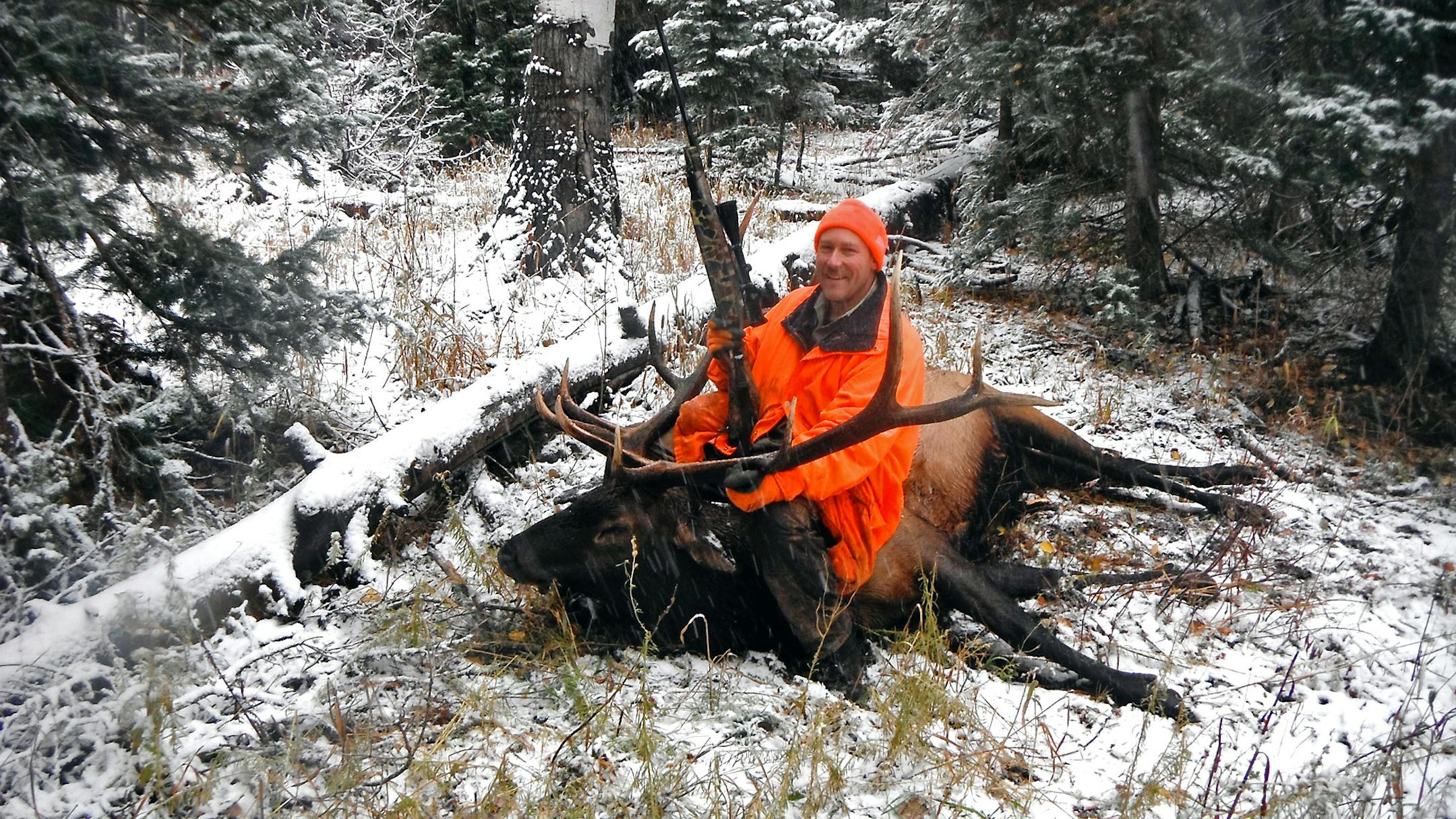 Andy Shoemaker, a retired St. Paul policeman, with a massive bull elk taken on a self-guided trip to Colorado last fall. Shoemaker and a friend rented horses to get them into high country.