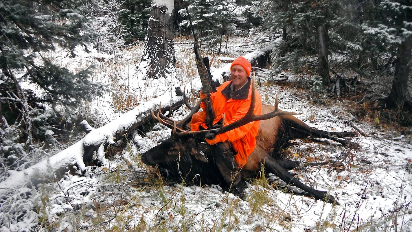 Andy Shoemaker, a retired St. Paul policeman, with a massive bull elk taken on a self-guided trip to Colorado last fall. Shoemaker and a friend rented horses to get them into high country.