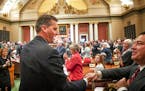 House Speaker Kurt Daudt received a standing ovation after he was elected again as Speaker. On the right Rep. Chris Swedzinski, R-Ghent, shook his han