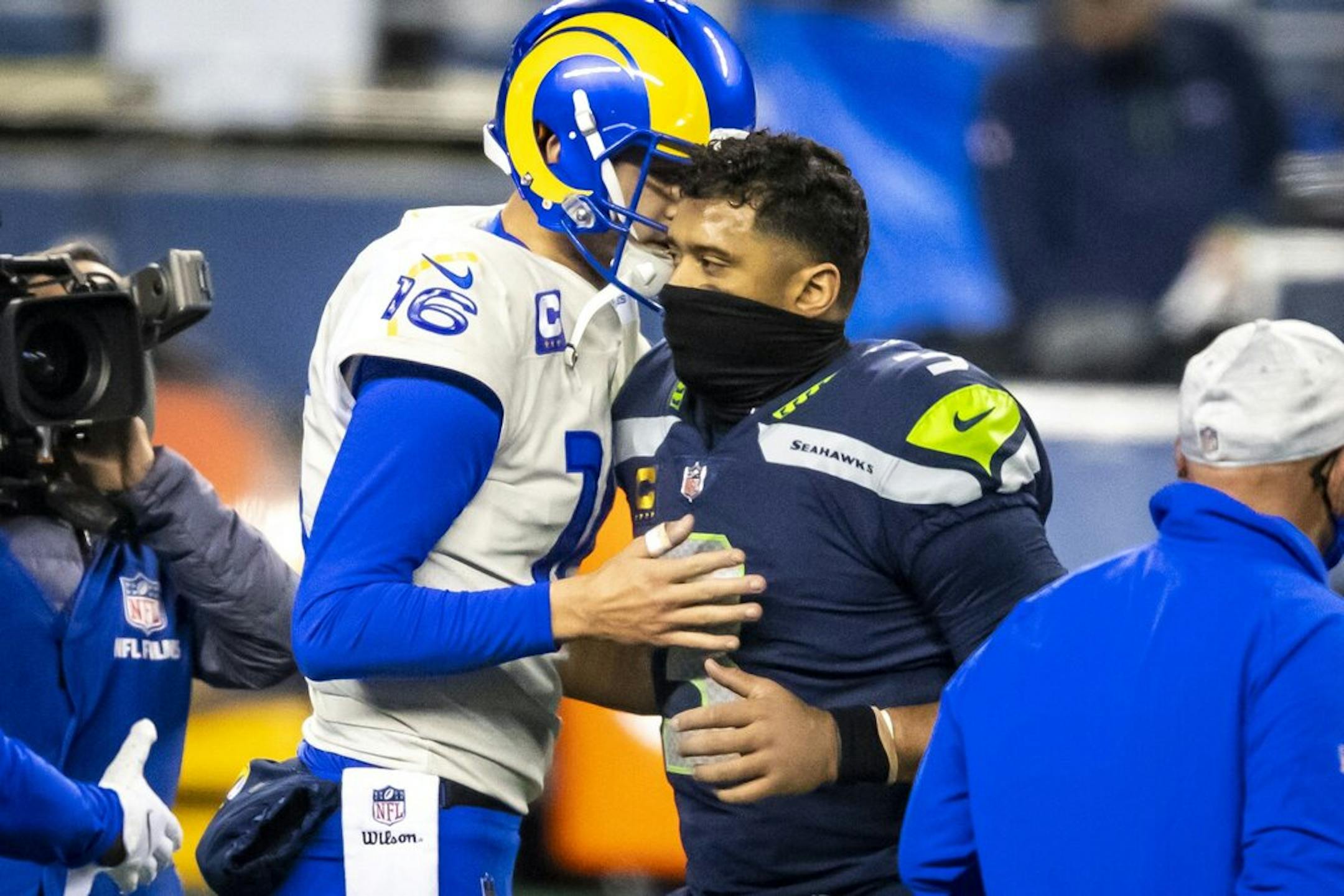 Los Angeles Rams quarterback Jared Goff (16) and Seattle Seahawks quarterback Russell Wilson (3) shake hands after the Rams' 30-20 win during the Wild Card round of the NFL Playoffs.