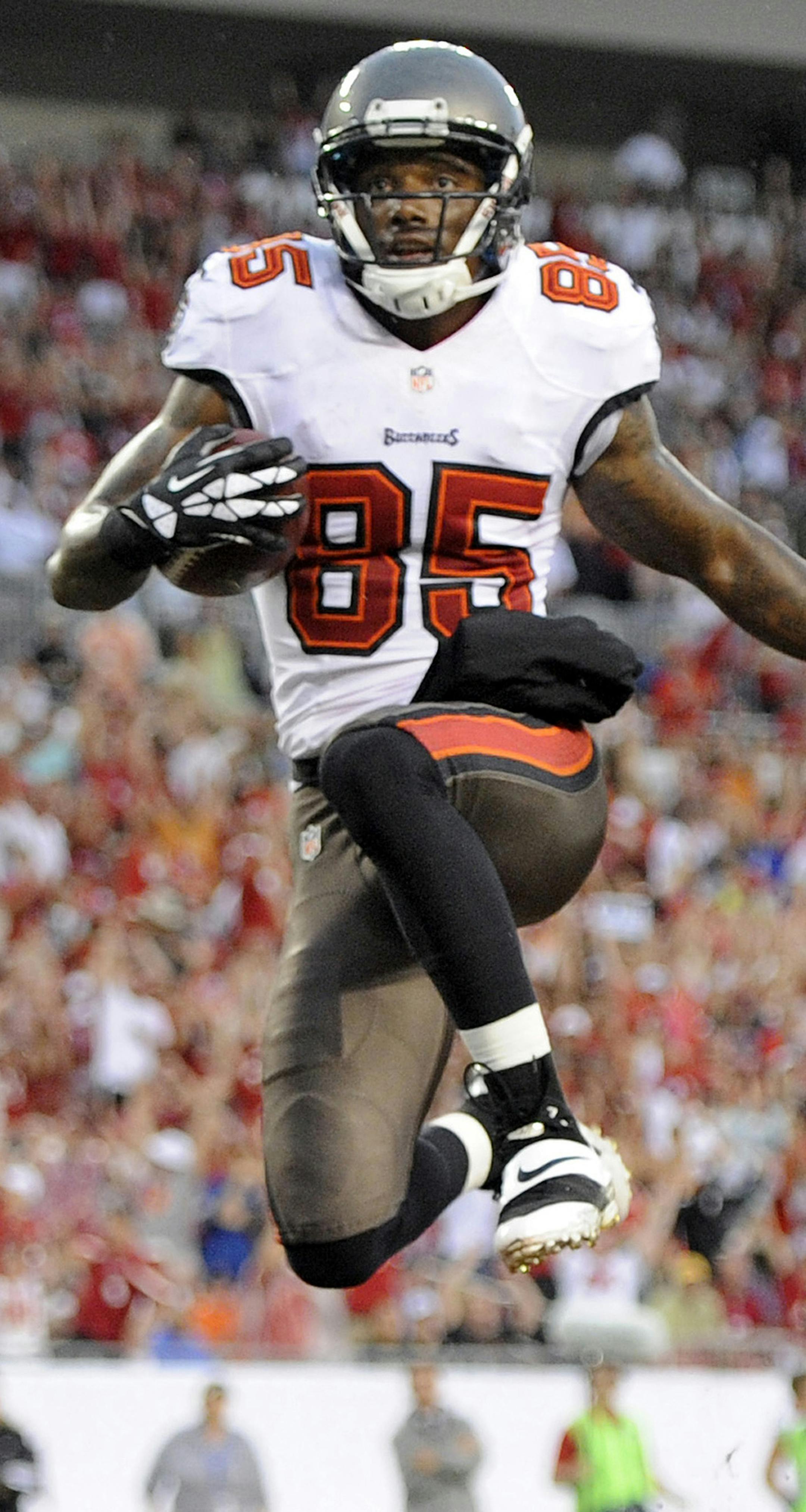 Tampa Bay Buccaneers wide receiver Kevin Ogletree (85) celebrates after scoring a touchdown against the New Orleans Saints during the first quarter of an NFL football game on Sunday, Sept. 15, 2013, in Tampa, Fla. (AP Photo/Brian Blanco)