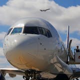 A Federal Aviation Administration official waited for members of the media to deplane after Delta pilot Jon Michael Pendleton explained the FAA's Next Generation Air Transportation System from the cockpit of an aircraft Tuesday.