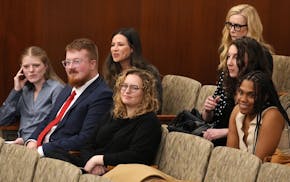 Supporters of Foster Advocates listen as lawmakers discuss a funding shortfall for a grant program serving former foster children who want to go to co