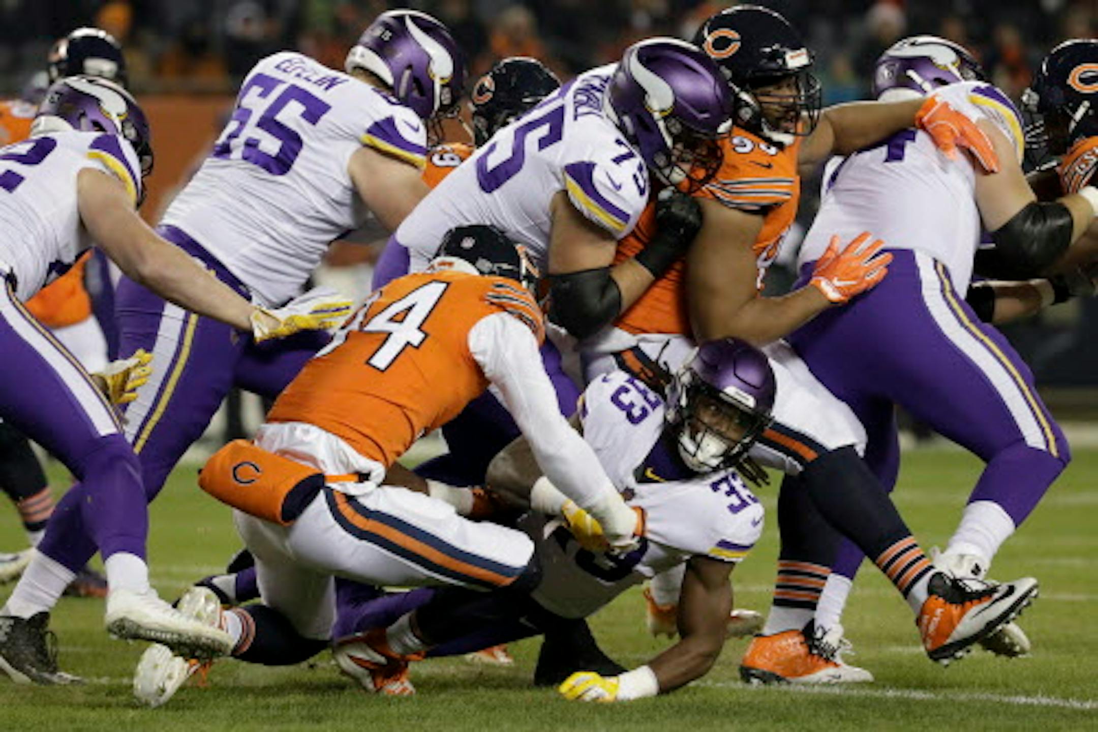 Chicago Bears linebacker Leonard Floyd (94) tackles Minnesota Vikings running back Dalvin Cook (33) during the first half of an NFL football game Sunday, Nov. 18, 2018, in Chicago. (AP Photo/Nam Y. Huh)