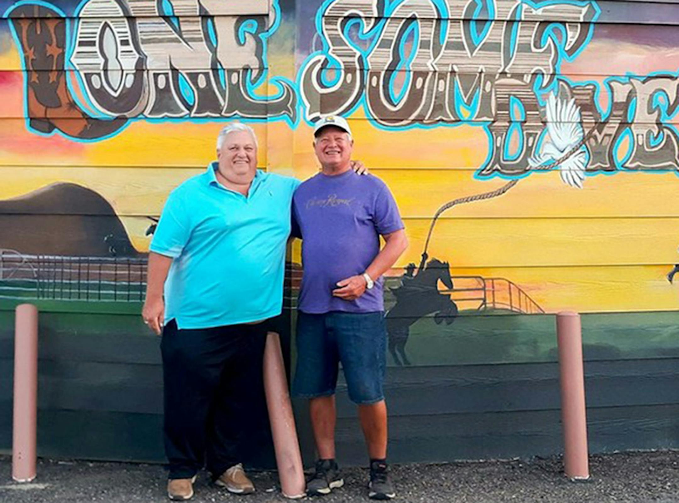 Lonesome Dove owners Brian Berube, left, and Augie Kersten paid $2,600 for the artwork.