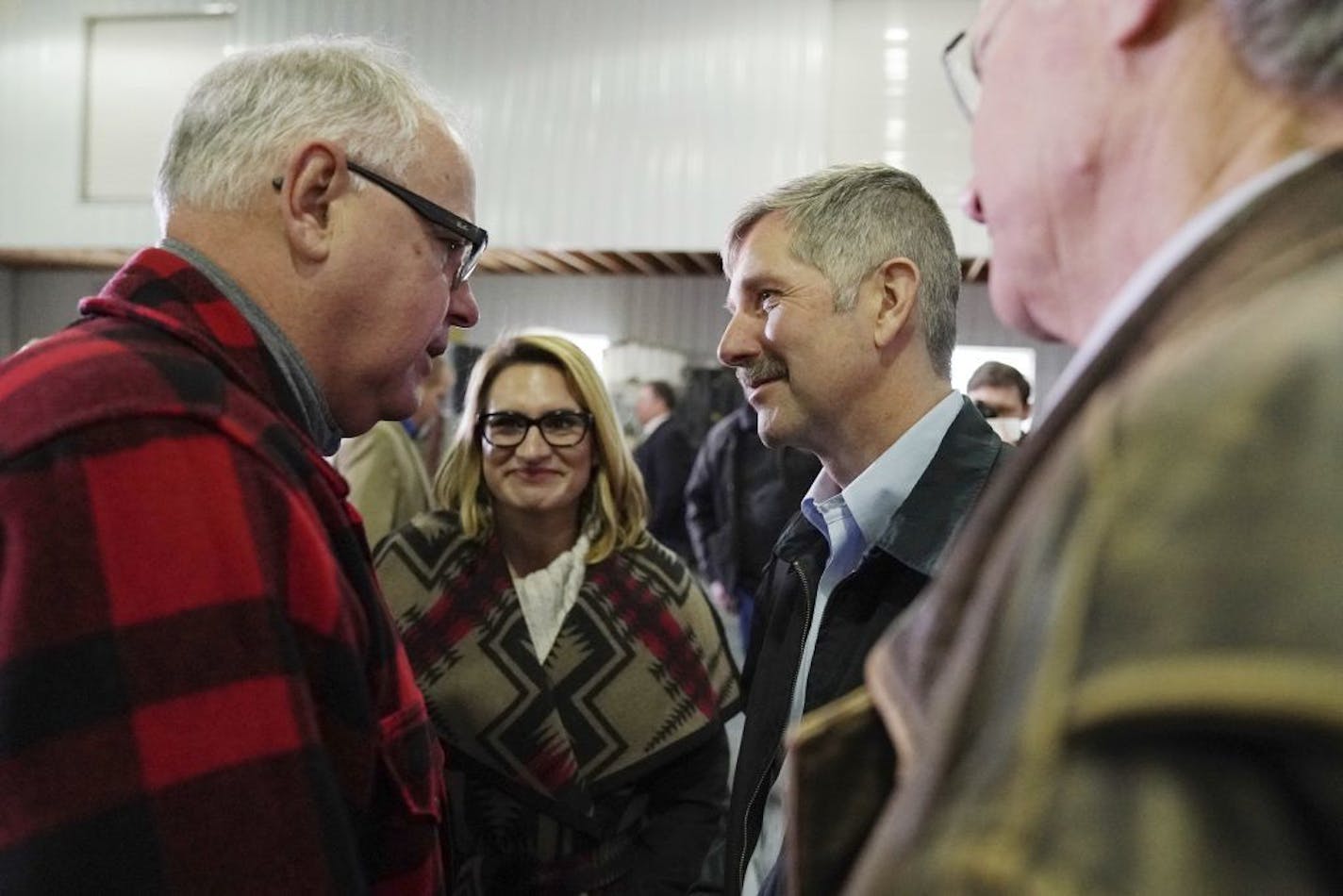 Gov.-elect Tim Walz speaks with State Sen. Tony Lourey after he announced Lourey will be commissioner of the Department of Human Services, Thursday, Jan. 3, 2019 at Bill Sorg's Dairy Farm in Hastings, Minn.