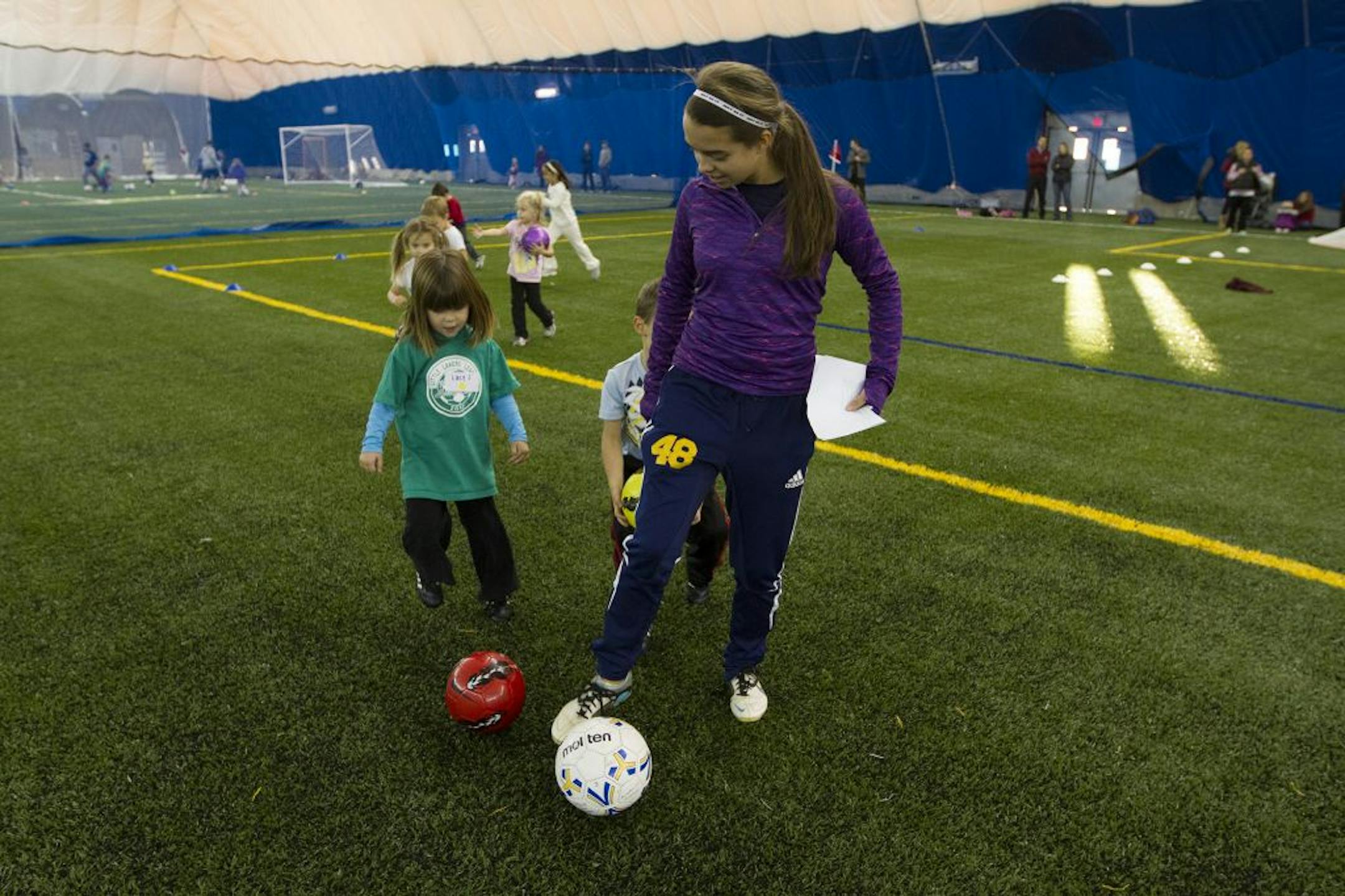 Prior Lake High School junior Mackenzie Mireau (cq/source) led a game of follow-the-leader with her group of five-year-olds.