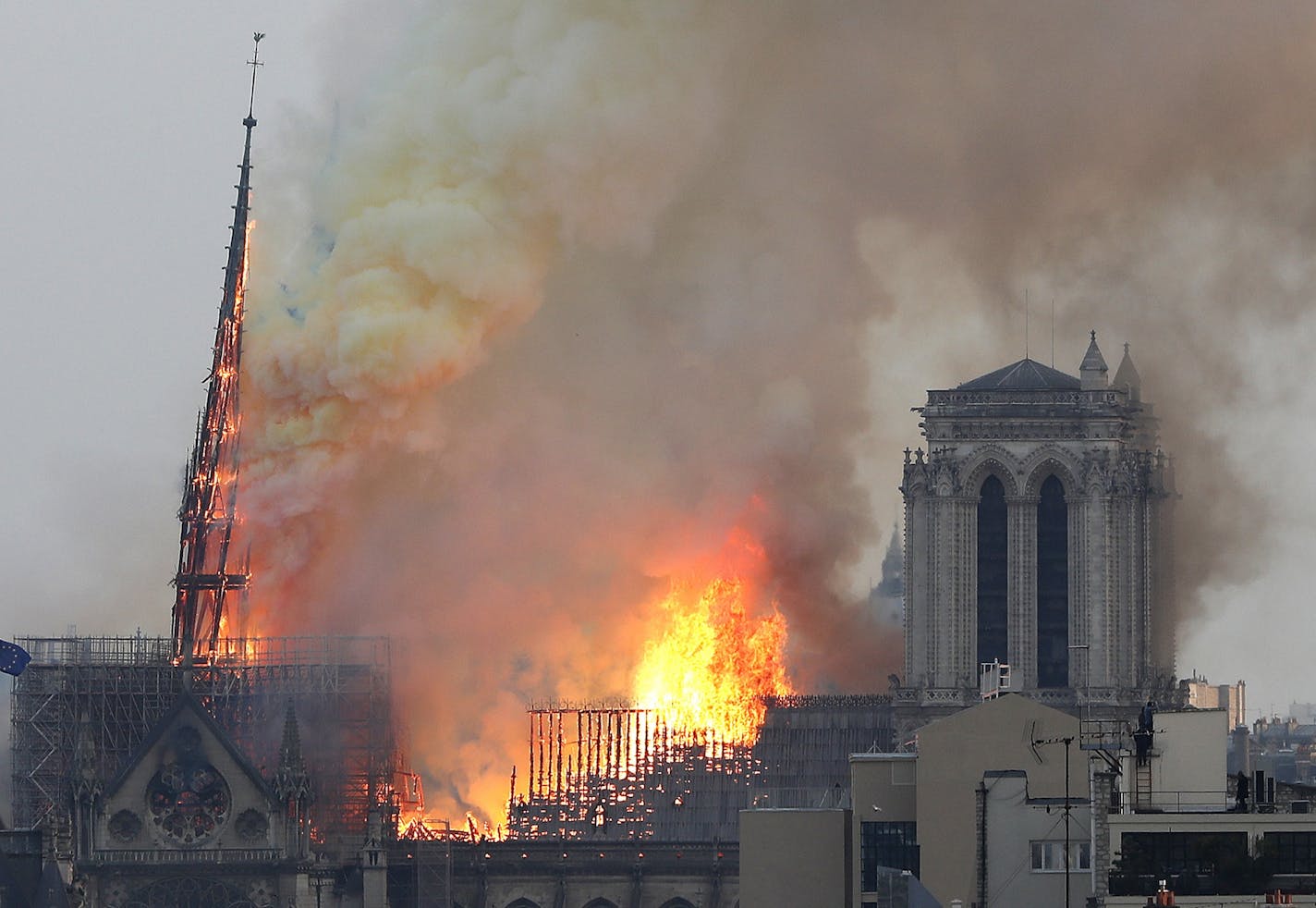 Flames rise from Notre Dame cathedral as it burns in Paris on Monday.