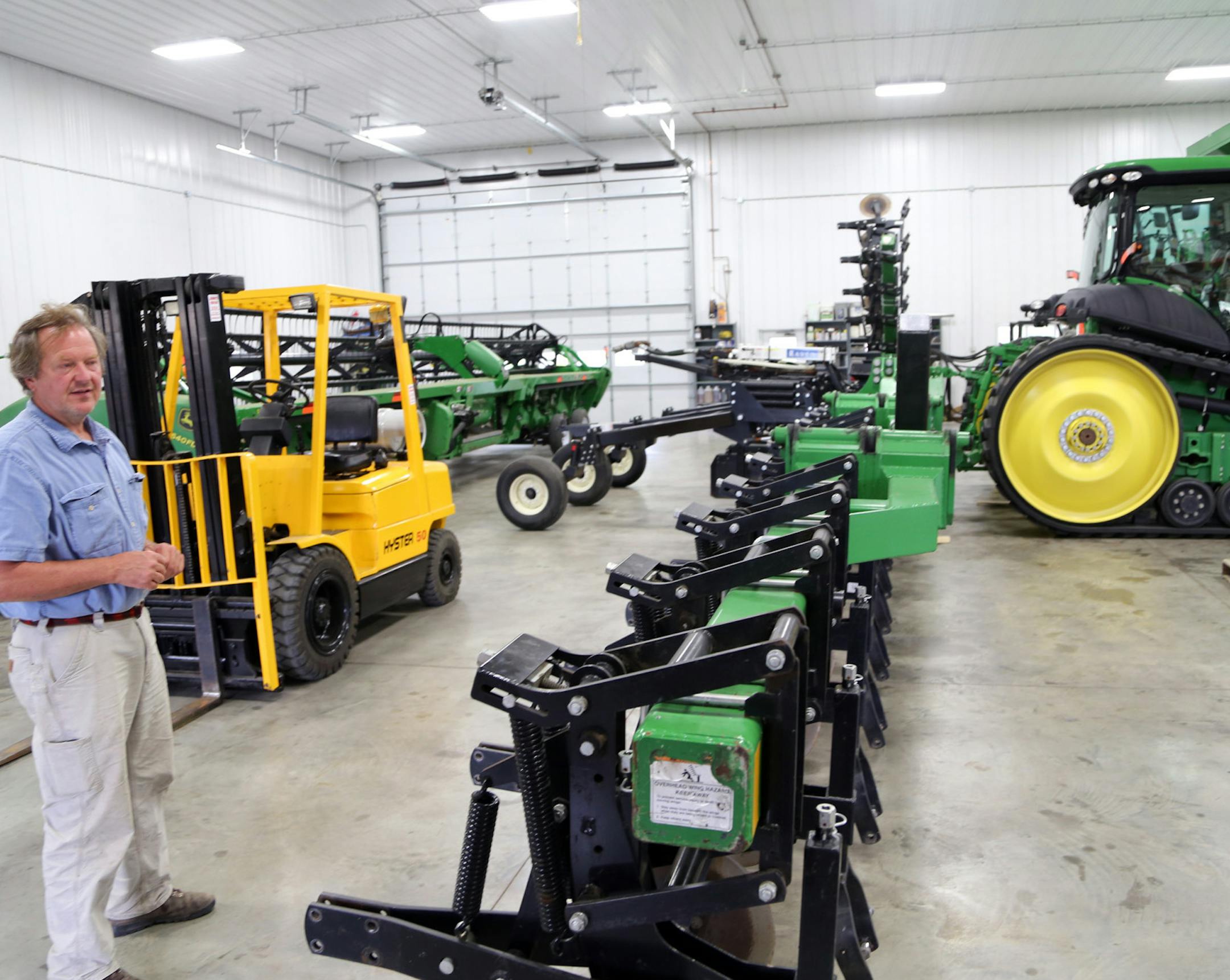 Tony Thompson’s equipment building houses the latest machinery designed to minimize the effect on his lands of corn and soybean farming. However, Thompson never buys new equipment, preferring to minimize financial outlay by purchasing good used combines, tractors and other gear.