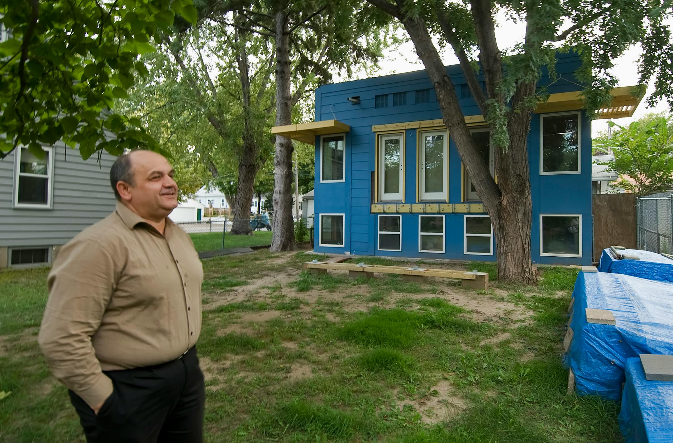Stjepan Hlacs in his front yard of his south Minneapolis home.