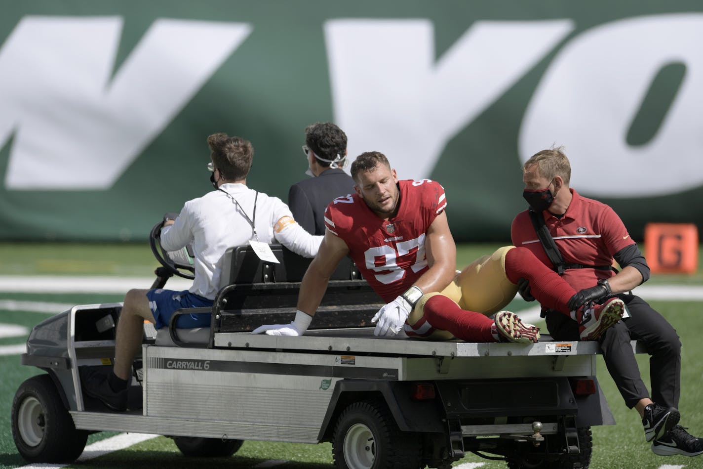 San Francisco 49ers defensive end Nick Bosa (97) is driven off the field after being injured during the first half of an NFL football game against the New York Jets Sunday, Sept. 20, 2020, in East Rutherford, N.J. (AP Photo/Bill Kostroun)