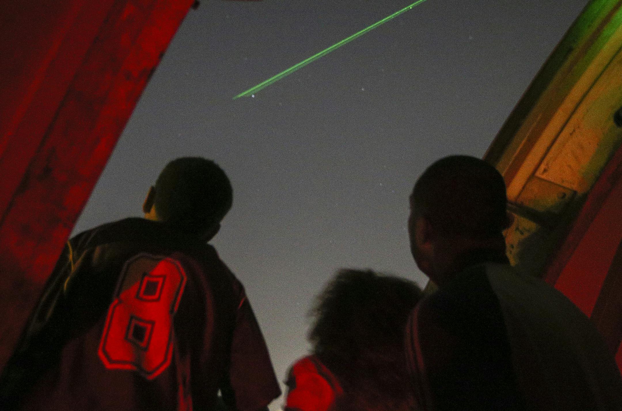 From left, Kelvin Vaye, Jr., Sophie Vaye, and father Kelvin Vaye, Sr. look up to a planet pointed out via a green laser. ] Timothy Nwachukwu &#x2022; timothy.nwachukwu@startribune.com Participants had a chance to view the wonders of the night sky at Eisenhower Community Center on Monday, August 8, 2016.