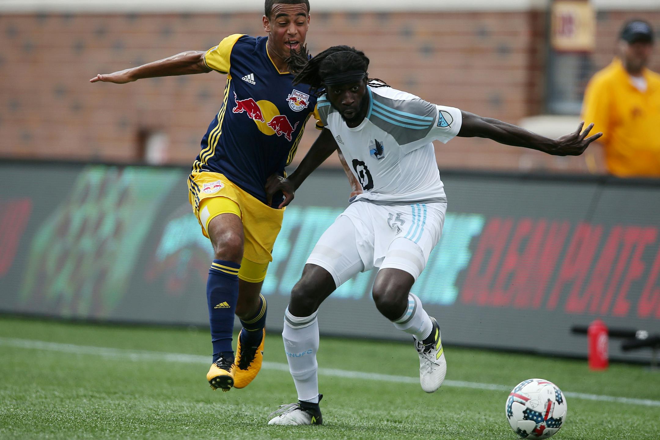 Minnesota United midfielder Ismaila Jome (15) moved the ball up field past New York Red Bulls midfielder Tyler Adams (4) in the first half.