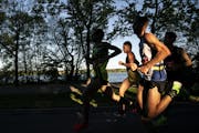 The men's leaders ran past Lake Harriet in the morning light at almost mile 8 during the 2019 Medtronic Twin Cities Marathon in Minneapolis, Minn., on